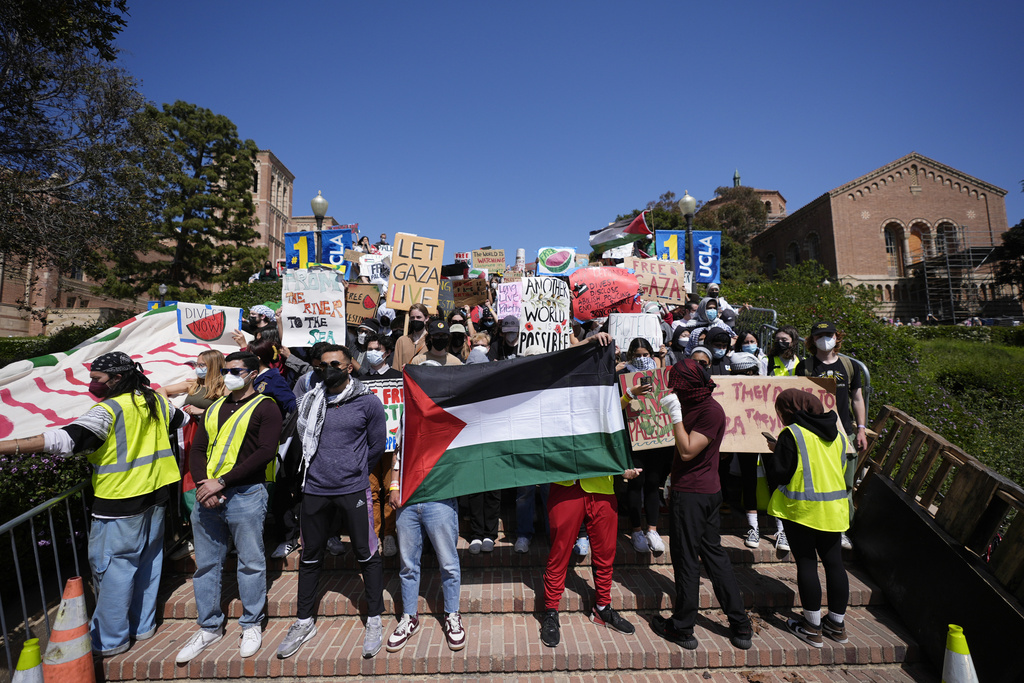  Demonstrators gather on the UCLA campus, after nighttime clashes between pro-Israel and pro-Palestinian groups, Wednesday, May 1, 2024, in Los Angeles. 