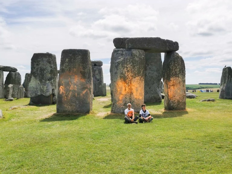 Climate activists vandalize Stonehenge with orange powder paint