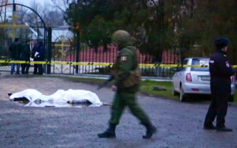 Police officers and priest among 15 killed after attacks on places of worship in southern Russia
