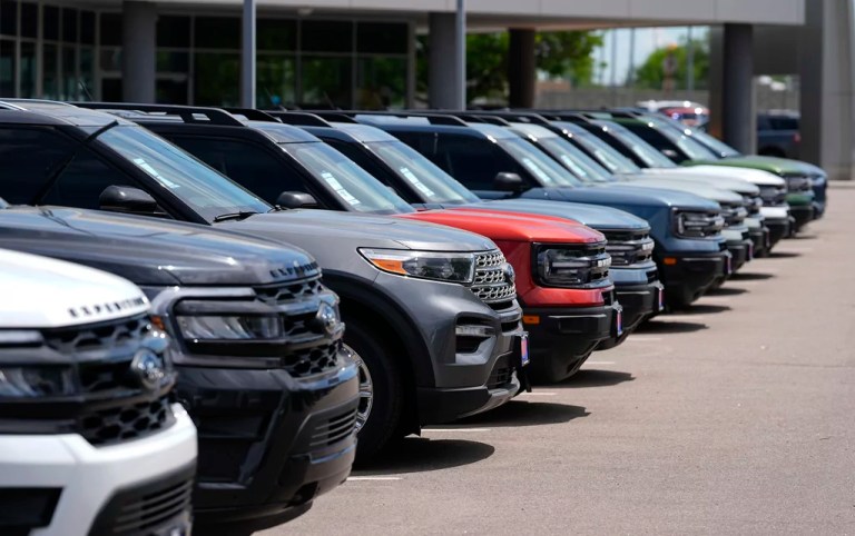 A line of unsold 2024 utility vehicles sit at a Ford dealership Sunday, May 19, 2024, in Denver.