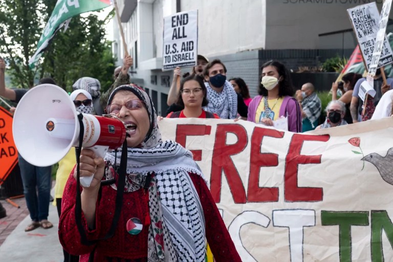 Jawahir Kamal leads pro-Palestinian protesters in a chant as they gather before a presidential debate between President Joe Biden and former President Donald Trump, Republican presidential candidate, in Atlanta, Thursday, June 27, 2024.