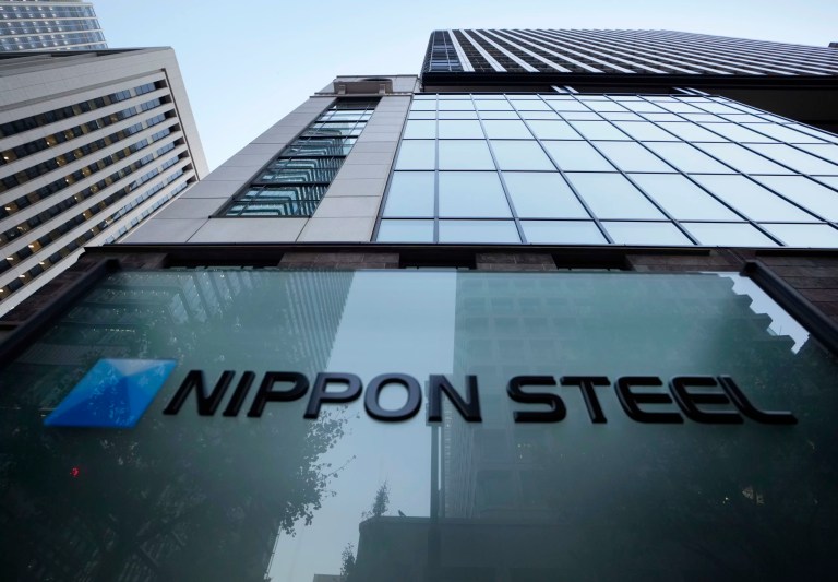 Nippon Steel's logo is displayed on a sign outside its headquarters in Tokyo, Nov. 26, 2021. Nippon Steel said Friday, May 3, 2024, it postponed the expected closing of its $14.1 billion takeover of U.S. Steel by three months after the Department of Justice requested more documentation related to the deal. (AP Photo/Hiro Komae)