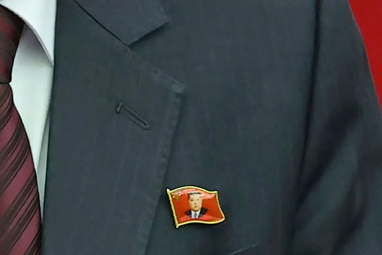 North Koreans seen wearing pins of Kim Jong Un