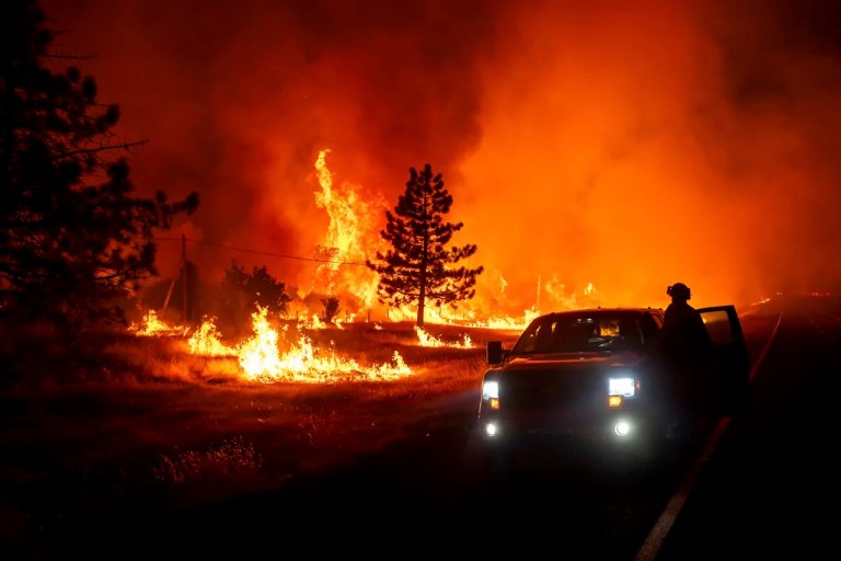 California’s largest wildfire explodes in size as fires rage across US West