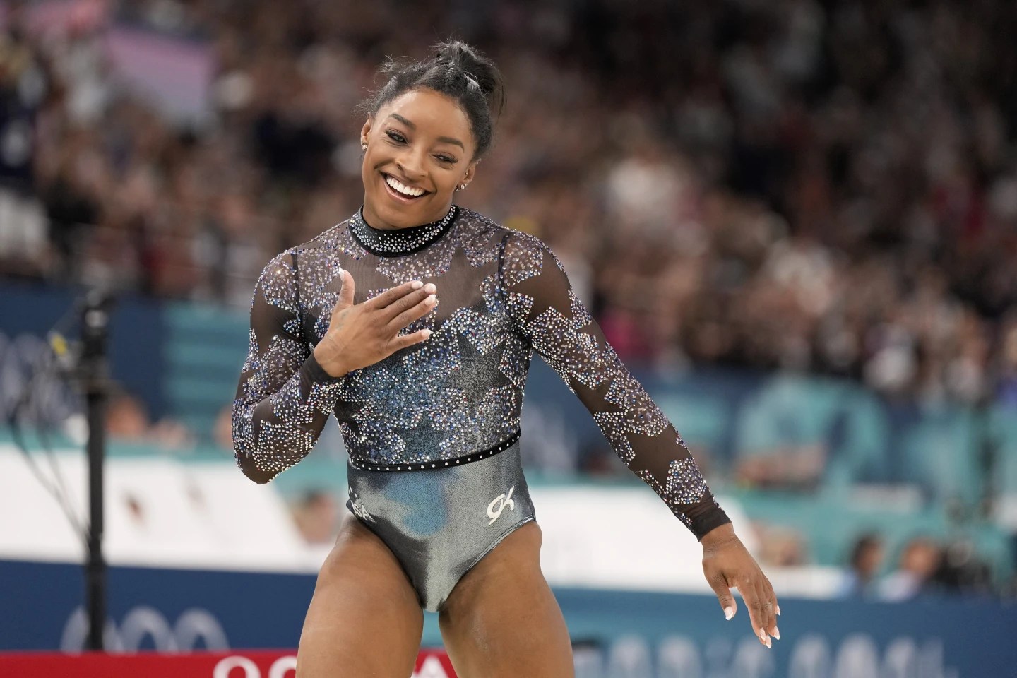 Simone Biles shakes off calf injury to dominate during Olympic gymnastics qualifying