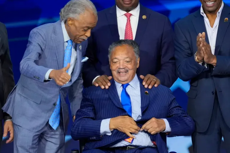 Al Sharpton talks to Rev. Jesse Jackson during the 2024 Democratic National Convention.