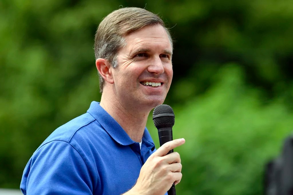 Kentucky Gov. Andy Beshear speaks at the Wayland Volunteer Fire Station in Wayland, Ky., Friday, July 26, 2024. Beshear handed over the keys to newly constructed homes to families that were displaced by the flooding 2 years ago.