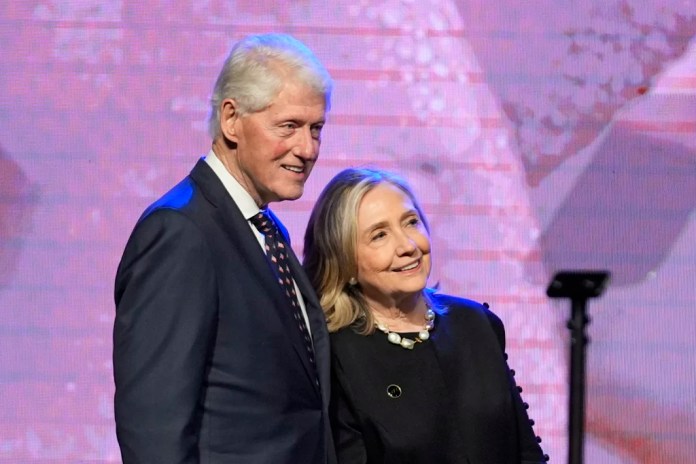 Former President Bill Clinton, left, and former Secretary of State Hillary Clinton listen as Vice President Kamala Harris delivers a eulogy for U.S. Rep.&nbsp;Sheila Jackson Lee, Thursday, Aug. 1, 2024, in Houston. (AP Photo/LM Otero)