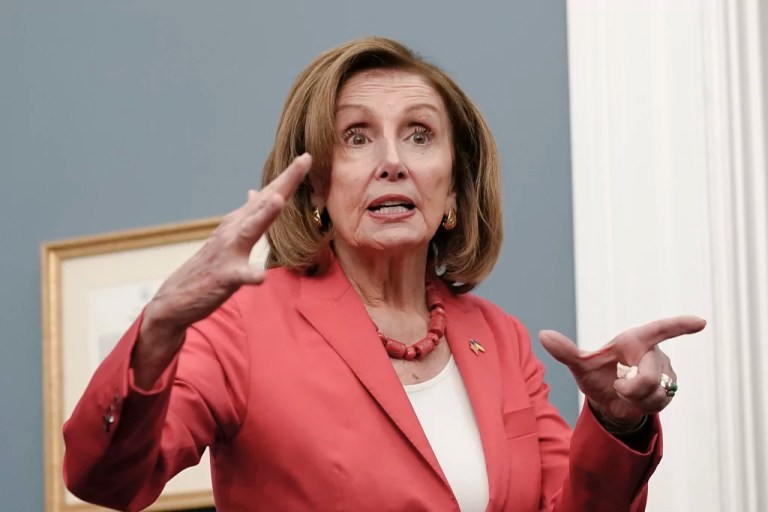Nancy Pelosi gestures with her hands