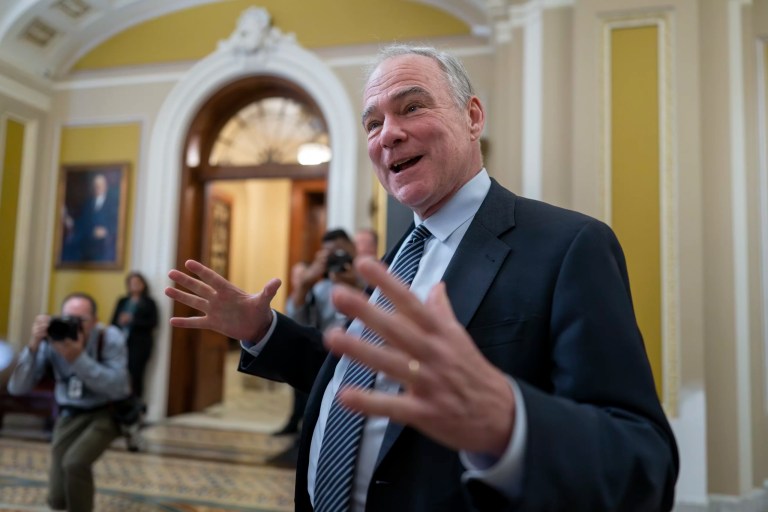 Sen. Tim Kaine (D-VA) speaks to reporters outside the chamber.