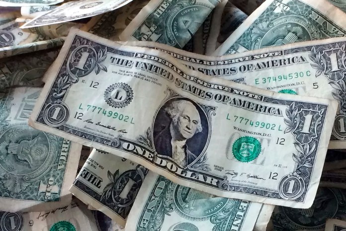 Dollar bills are shown in New York, Oct. 24, 2016.