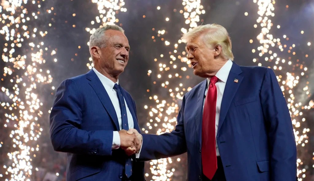 Former President Donald Trump, Republican presidential nominee, shakes hands with Independent presidential candidate Robert F. Kennedy Jr. at a campaign rally at the Desert Diamond Arena, Friday, Aug. 23, 2024, in Glendale, Arizona.