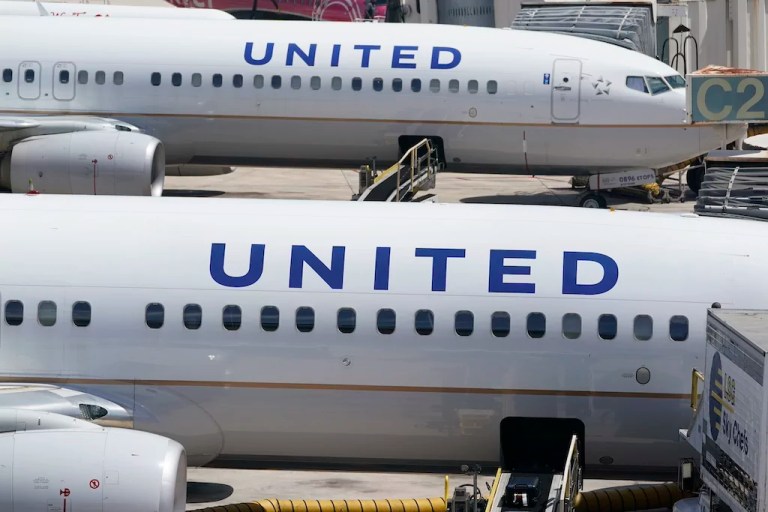 Two United Airlines Boeing 737s are parked at the gate at the Fort Lauderdale-Hollywood International Airport in Fort Lauderdale, Fla., on July 7, 2022. United Airlines said Monday, Jan. 22, 2024, it will lose money in the first three months of this year because of the grounding of its Boeing 737 Max 9 planes after a panel blew out of a Max jetliner this month.