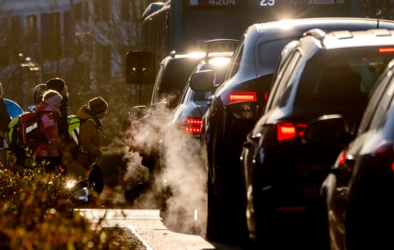 Cars release exhaust fumes as children head to school in Frankfurt, Germany, Feb. 27, 2023. European Union member countries have watered down a proposal by the bloc's executive arm aimed at lowering vehicle emissions. The European Commission had proposed last year updated pollution standards for new combustion engine vehicles that are expected to remain on European roads well after the 27-nation bloc bans their sale in 2035, with the aim of lowering emissions from tailpipes, brakes and tires.