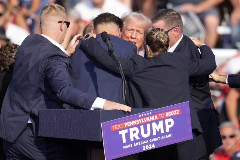 Former President Donald Trump, Republican presidential candidate, is surrounded by Secret Service at a campaign event in Butler, Pennsylvania, July 13, 2024. A senior FBI official says the gunman in the assassination attempt of Trump searched online for events of both Trump and President Joe Biden and saw the Pennsylvania campaign rally where he opened fire last month as a “target of opportunity.