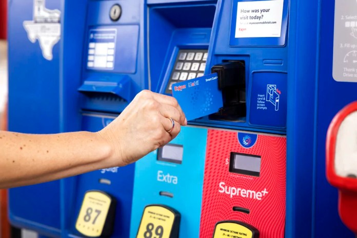 IMAGE DISTRIBUTED FOR EXXONMOBIL - Exxon station customer uses Exxon Mobil Smart Card+ Credit Card to pay for gas on Tuesday, Dec. 06, 2022 in Humble, Texas. (Paul Ladd/AP Images for ExxonMobil)