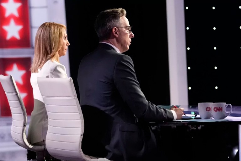 CNN's Dana Bash, left, and Jake Tapper listen as they moderate a presidential debate between former President Joe Biden and President Donald Trump, Thursday, June 27, 2024, in Atlanta.