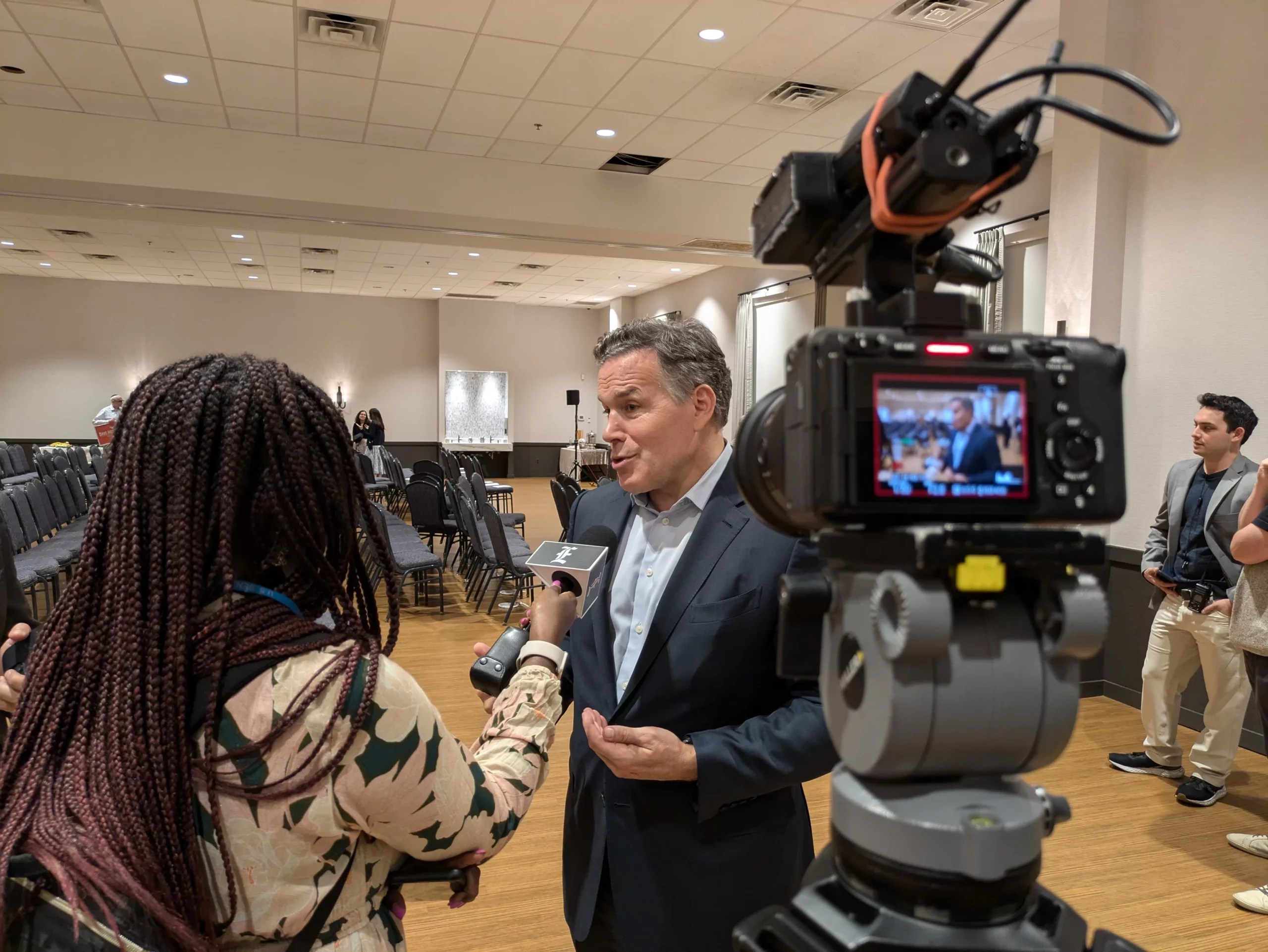 Alt text Dave McCormick in a synagogue speaking into a Washington Examiner microphone. 