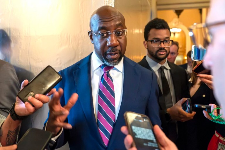 Sen. Raphael Warnock (D-GA) speaks with reporters, Sept. 28, 2023, in Washington.