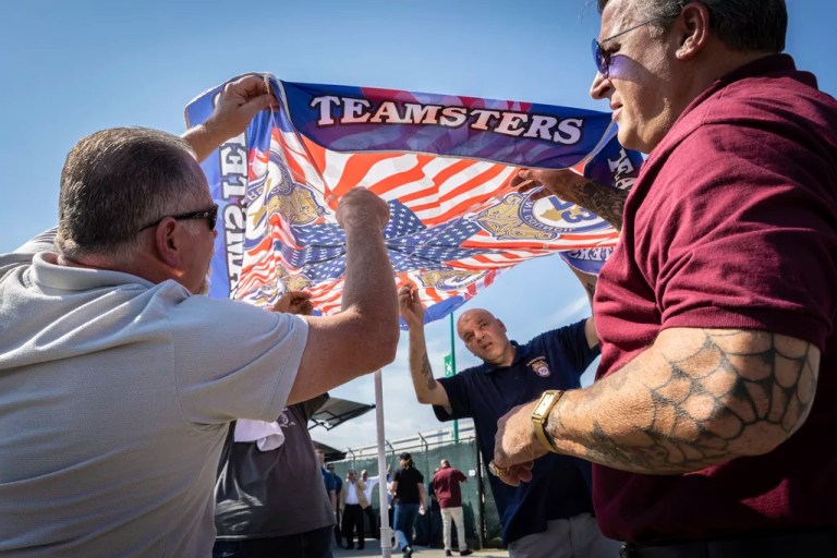Teamsters union members help put up an umbrella outside the Staten Island Amazon facility JFK8 on Wednesday, June 19, 2024 in New York. More than 5000 Amazon workers voted by 98% percent this week to affiliate the Amazon Labor Union with the International Brotherhood of Teamsters (ALU-IBT Local 1). Newly chartered ALU- IBT will provide jurisdiction across New York's five boroughs.