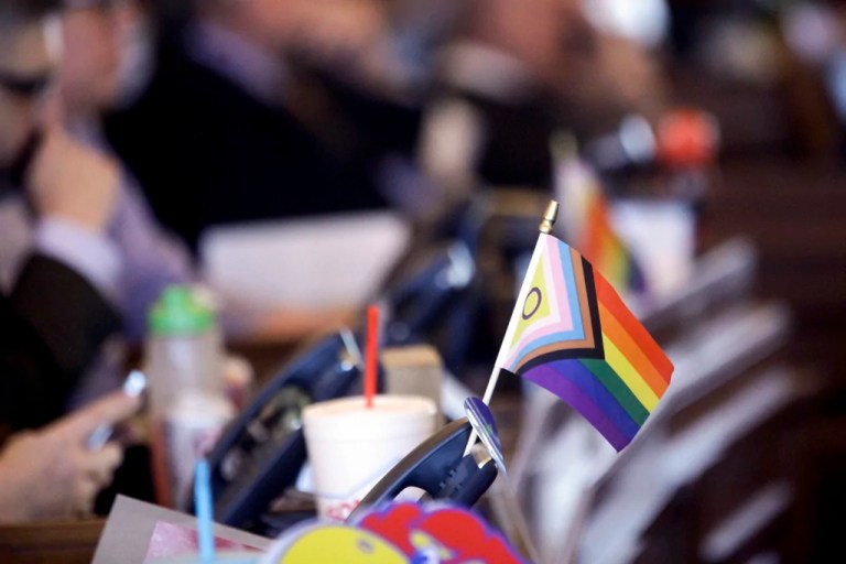 A flag supporting LGBT rights decorates a desk on the Democratic side of the Kansas House of Representatives during a debate, March 28, 2023, at the Statehouse in Topeka, Kansas.