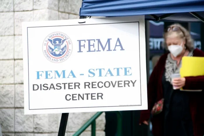 People gather at a FEMA Disaster Recovery Center at A.C. Reynolds High School in Asheville, North Carolina, Tuesday, Oct. 15, 2024.