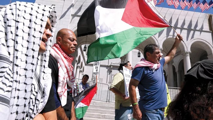 The Palestinian Youth Movement, Southern California Students for Justice in Palestine, and others attend a press conference at City Hall denouncing the attacks against pro-Palestinian protesters in Los Angeles on June 25. (Genaro Molina/Los Angeles Times via Getty Images)