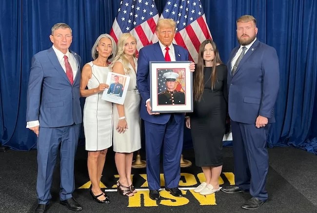 Warren Douglas Quets (left), WIFE (second from left), LADY (third from left, LADY (second from right), brother-in-law Philip Sweet (right) stand with former President Donald Trump during a private meeting in Tempe, AZ, Thursday evening. (Courtesy image provided to the Washington Examiner)