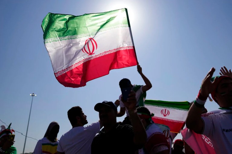 Supporters wave Iranian flags ahead of the World Cup group B soccer match between Wales and Iran, at the Ahmad Bin Ali Stadium in Al Rayyan, Qatar, Friday, Nov. 25, 2022.