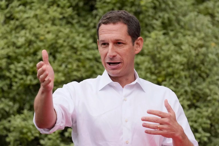 San Francisco Mayor Daniel Lurie gestures while meeting with people at a neighborhood event in San Francisco, Saturday, Sept. 21, 2024.