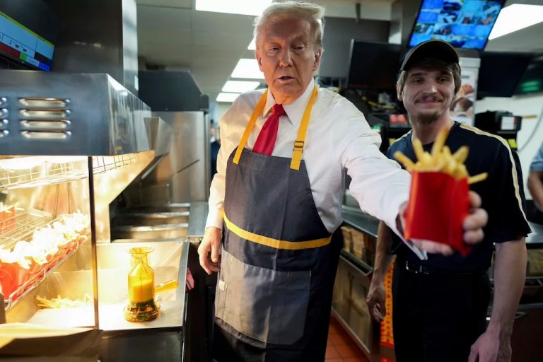 Former President Donald Trump prepares french fries at a Pennsylvania McDonald's.