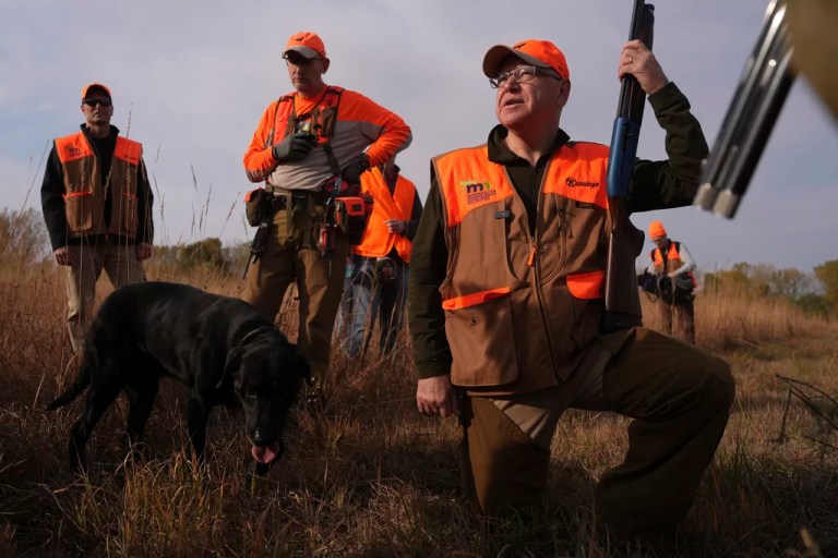 Walz tramps through tall grass but bags no birds as pheasant hunting season opens