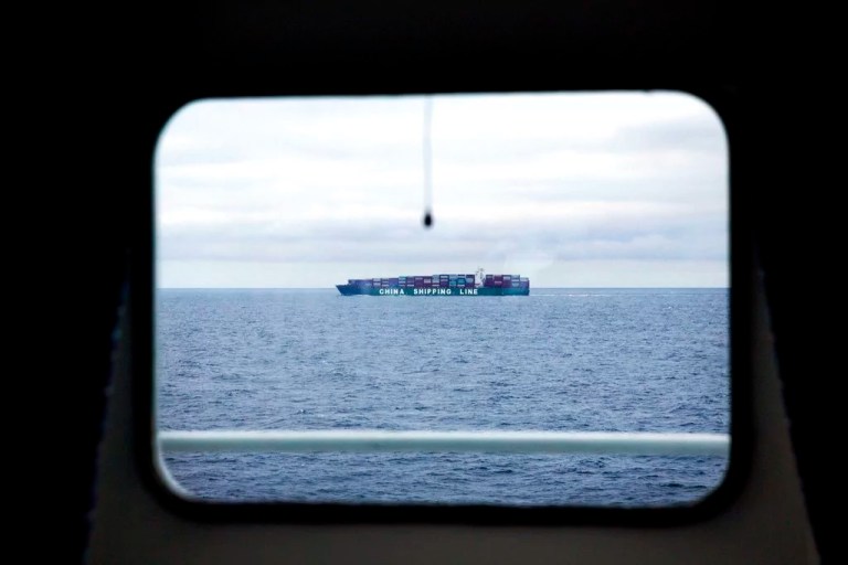 A China Shipping Line cargo ship sails sails the North Pacific Ocean off the coast of Alaska past the Finnish icebreaker MSV Nordica, Tuesday, July 11, 2017. Low oil prices that have made the Arctic shortcut less attractive to freight companies are one of the reasons, along with public pressure, why the search for fossil fuels above North America has also slowed in recent years.