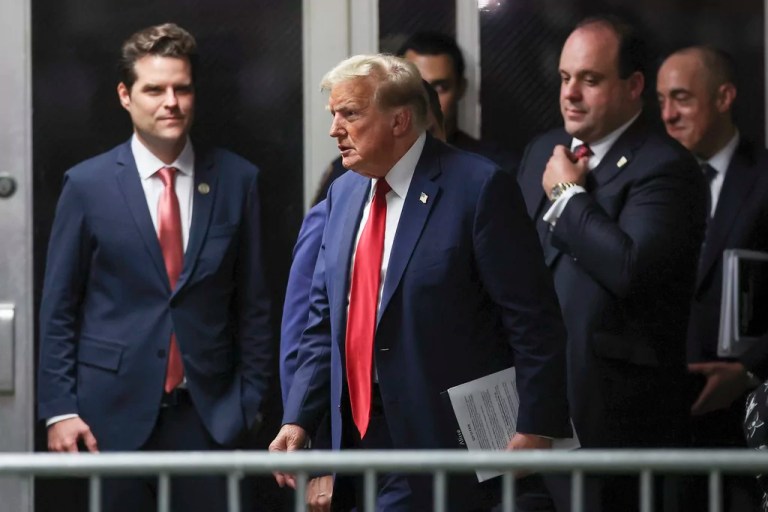 Former President Donald Trump, center, walks by Rep. Matt Gaetz, left, R-Fla., outside the courtroom after the day's proceedings in his trial Thursday, May 16, 2024, in New York. Trump's adviser Boris Epshteyn, and attorney Emil Bove, right, follow behind him. (Mike Segar/Pool Photo via AP)
