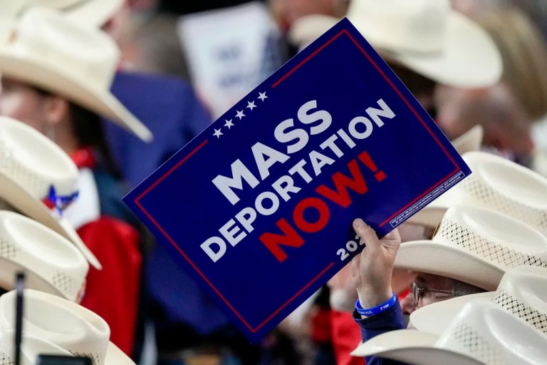 A member of the Texas delegation holds a sign during the Republican National Convention July 17, 2024, in Milwaukee, Wisconsin.