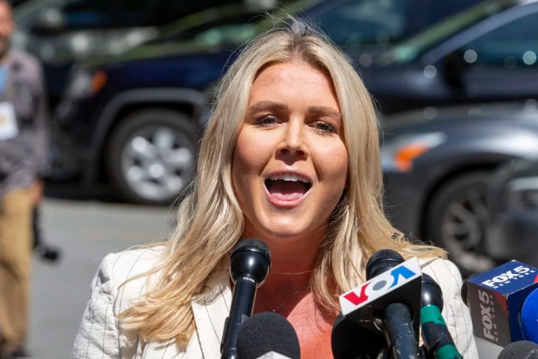 White House press secretary Karoline Leavitt speaks to the news media across the street from President Donald Trump's criminal trial in New York, May 28, 2024.