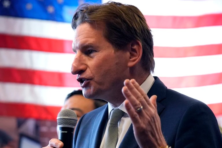 Democratic presidential candidate Rep. Dean Phillips, D-Minn., gestures while addressing a gathering during a campaign stop, Thursday, Jan. 18, 2024, in Manchester, N.H.