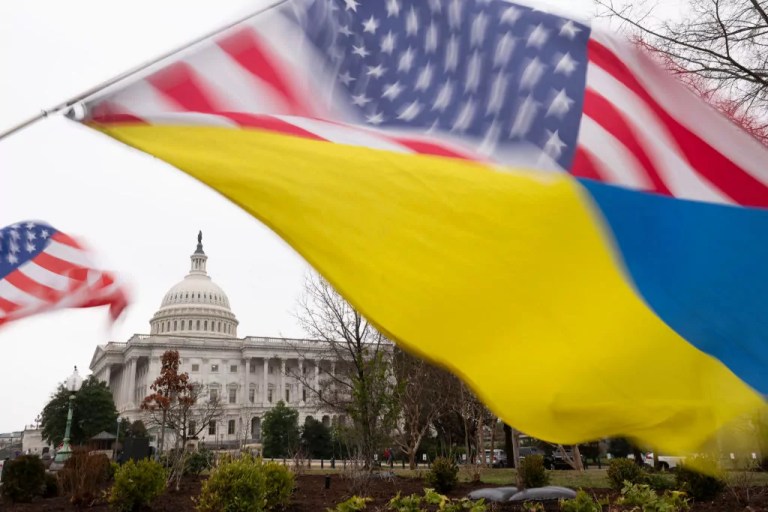 Ukraine sympathizers fly a Ukrainian flag outside as the Senate works through the weekend on a $95.3 billion foreign aid bill with assistance for Ukraine and Israel at the Capitol, Feb. 11, 2024, in Washington, D.C.