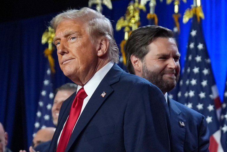 Republican presidential nominee former President Donald Trump and his running mate, Sen. JD Vance (R-OH), stand on stage at an election night watch party at the Palm Beach Convention Center, Wednesday, Nov. 6, 2024, in West Palm Beach, Florida.