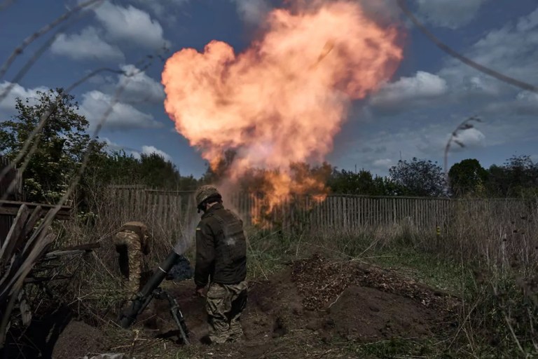 A mortar unit with a 120 mm mortar prepares to perform a combat mission on May 18, 2024 in the Kharkiv region, near the border with Russia. Ukrainian soldiers from the 92nd assault brigade were involved in holding back the Russians on the border with Russia. In recent days Russian forces have gained ground around the Kharkiv region, which Ukraine had largely reclaimed in the months following Russia's initial large-scale invasion in February 2022.