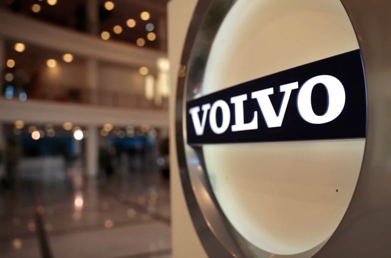This Feb. 6, 2020, file photo shows the Volvo logo in the lobby of the Volvo corporate headquarters in Brussels. Swedish automaker Volvo said Monday, Oct. 4,2021 it plans to raise at least 25 billion kroner ($2.9 billion) by selling shares to fund its electric vehicle transformation strategy. Volvo and its parent company, Chinese carmaker Geely, have applied to hold an initial public offering on the Nasdaq Stockholm