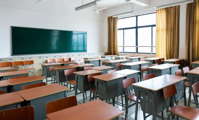 School classroom with desks and chalkboard in Chinese high school
