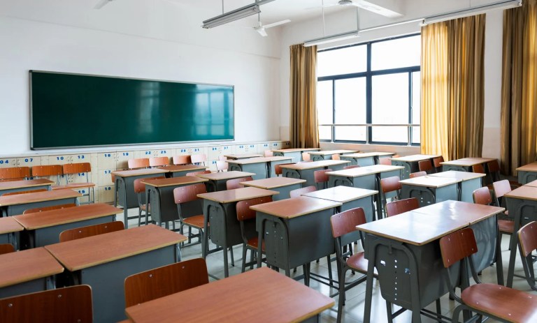 School classroom with desks and chalkboard in Chinese high school