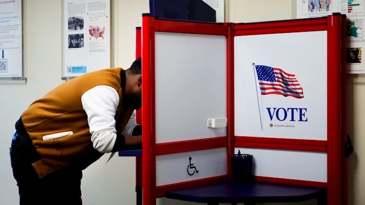 Bahiru Abide fills out his ballot at King County Elections headquarters on Election Day, Tuesday, Nov. 5, 2024, in Renton, Washington.