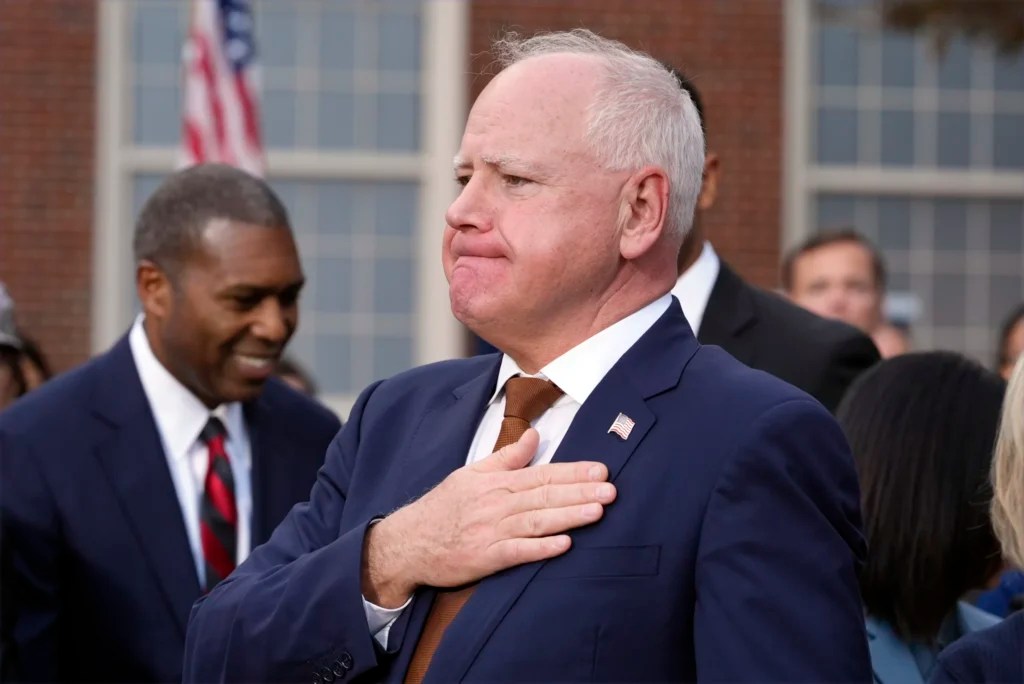Minnesota Gov. Tim Walz listens as Vice President Kamala Harris delivers a concession speech after the 2024 presidential election, Wednesday, Nov. 6, 2024, on the campus of Howard University in Washington.