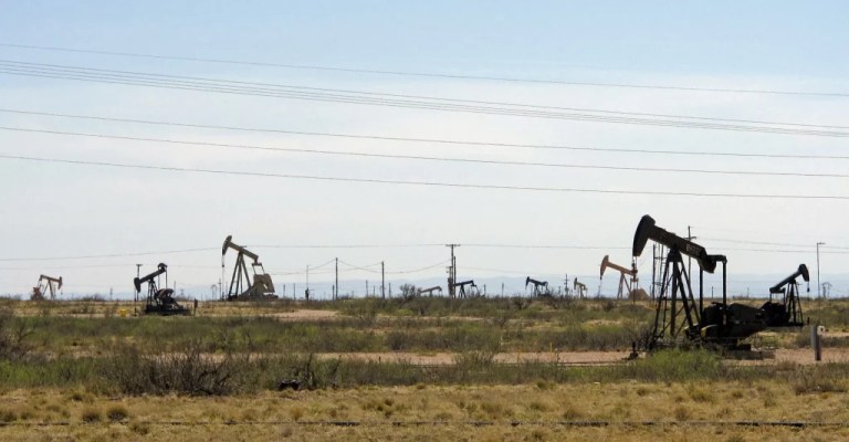 Oil rigs stand in the Loco Hills field