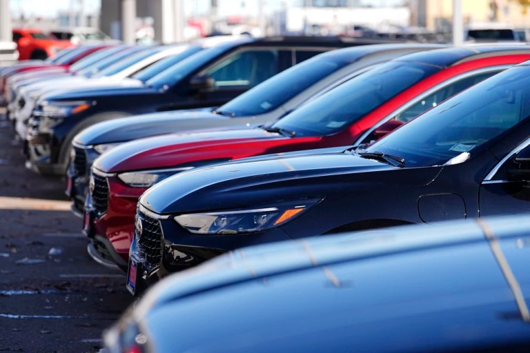A long line of unsold 2024 Escape utility vehicles sit on display at a Ford dealership Thursday, Nov. 28, 2024, in southeast Denver, Colorado.