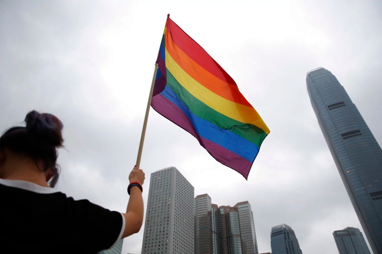 A participant holds a rainbow flag at the annual Pride Parade in Hong Kong, Nov. 17, 2018.