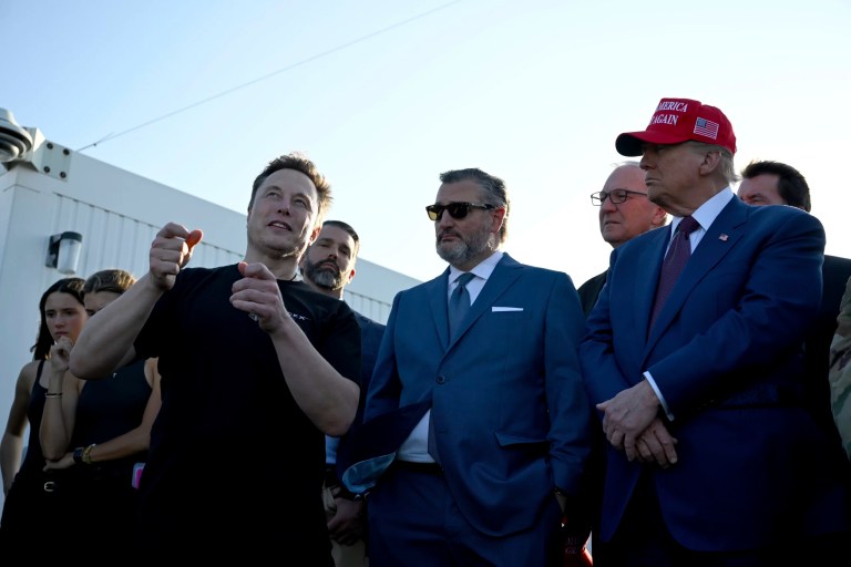 President-elect Donald Trump speaks with Elon Musk as Sen. Ted Cruz (R-TX), center, listens before attending a viewing of the launch of the sixth test flight of the SpaceX Starship rocket, Tuesday, Nov. 19, 2024, in Boca Chica, Texas.