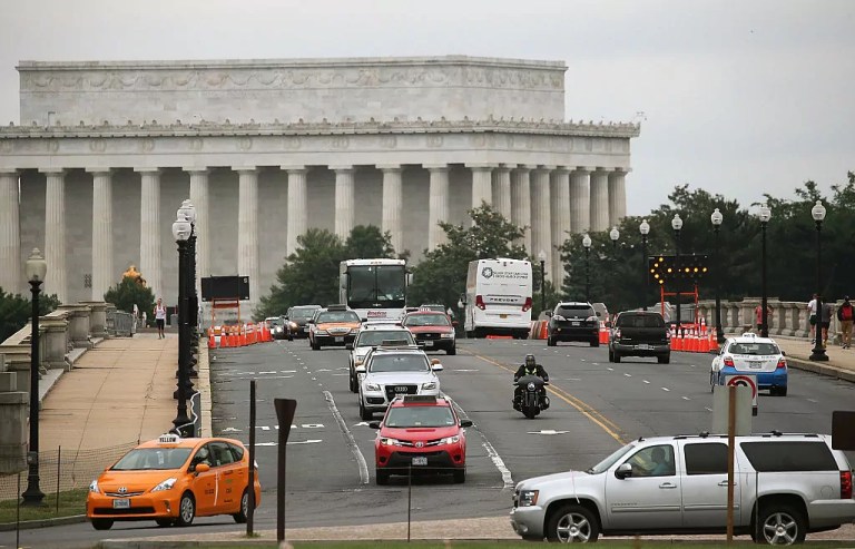 Traffic moves over the Memorial Bridge near the Lincoln Memorial in Washington, D.C.